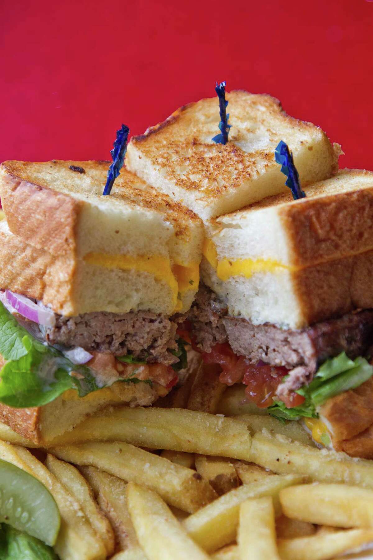 5/7/2012 : The Ginormous BLT Double Grilled Cheese Ranch Burger at Houston Texans Grille located at 12848b Queensbury Lane, Suite 208, Houston, Texas in the City Centre at I-10 and Beltway * in Houston, Texas, For the Chronicle: Thomas B. Shea