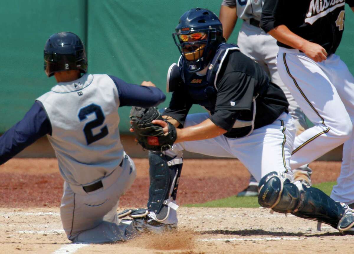 Missions catcher Ali Solis tags out Corpus Christi’s Ryan McCurdy in the fourth inning.