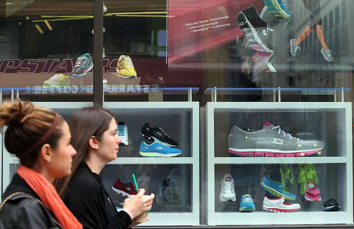 Customers continue to shop at San Francisco's Skechers Shoe store on Powell Street Wednesday, May 16, 2012 in San Francisco Calif, after the shoe company agreed to a $40 million dollar settlement with the federal Trade Commission and 44 states including California over falsely advertising the weight loss and health benefits of its Shape-Up, Tone-Up and resistance Runners shoes.