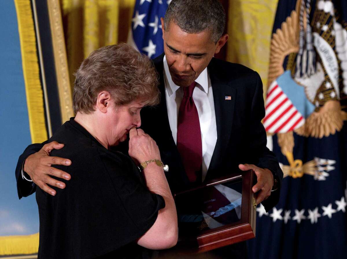 President Barack Obama awards posthumously the Medal of Honor to Rose Mary Sabo-Brown, widow of Specialist Leslie H. Sabo, Jr., US Army, during a ceremony in the East Room of the White House in Washington, Wednesday, May 16, 2012. Sabo was killed in 1970 in Cambodia during the Vietnam War.