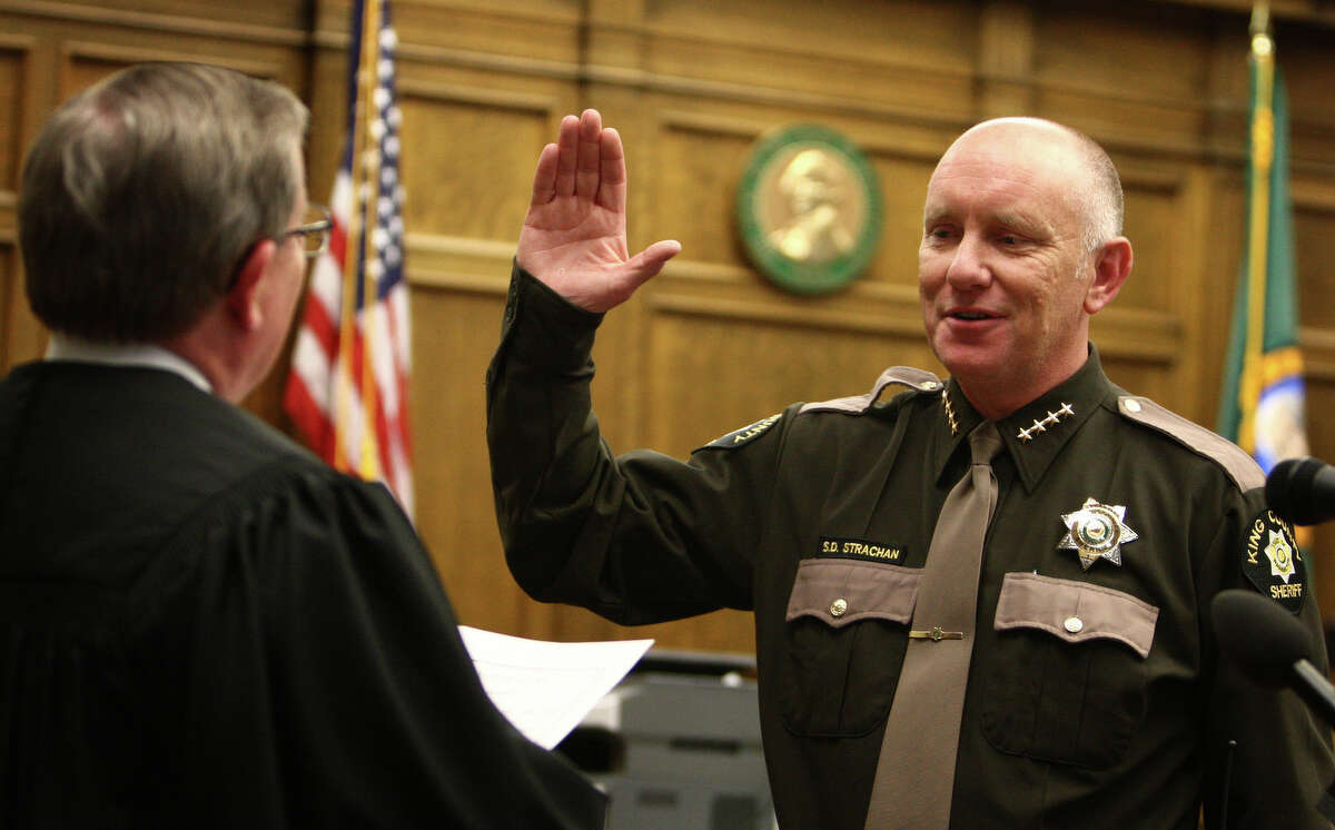 King County Sheriff Steve Strachan is sworn in by King County Superior Court Judge Richard McDermott during a ceremony on Wednesday, May 16, 2012 at the King County Courthouse.