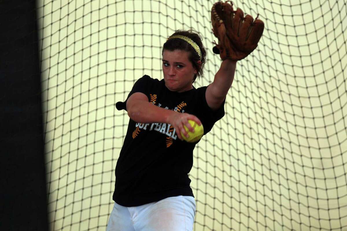 Danbury High School's Bailey Carter pitches during practice Wednesday, May 16, 2012, in Danbury.
