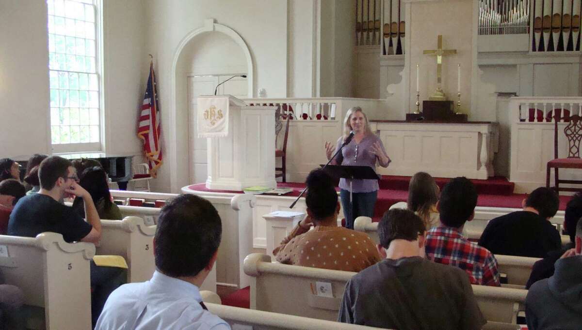 Rev. Alida Ward, co-pastor of Greenfield Hill Congregational Church, talks to students from Fairfield Warde High School during a religion and social action tour arranged Tuesday by teacher Jim D'Acosta, who started the annual tours in 1997 as an extension of the western civilization course he was teaching. Students visited four different houses of worship on the tour.