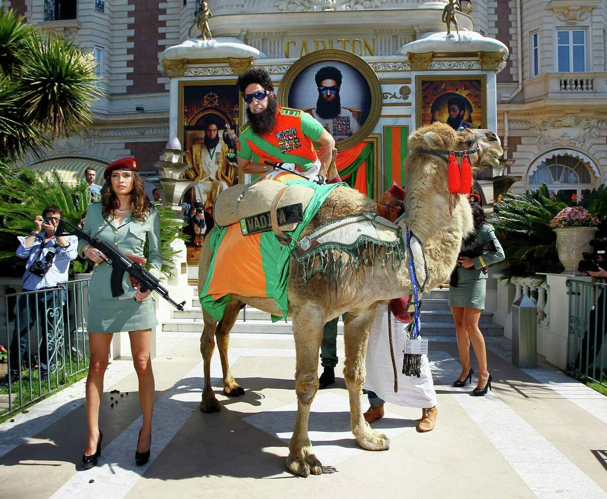 Actor Sacha Baron Cohen poses on top of a camel during a photo call for The Dictator at the 65th international film festival, in Cannes, southern France, Wednesday, May 16, 2012. (AP Photo/Francois Mori)
