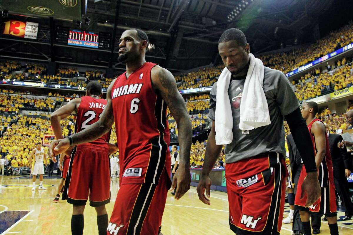 Miami Heat's LeBron James (6) and Dwyane Wade, right, leave the court after losing 94-75 to the Indiana Pacers in Game 3 of their NBA basketball Eastern Conference semifinal playoff series, Thursday, May 17, 2012, in Indianapolis. (AP Photo/Darron Cummings)