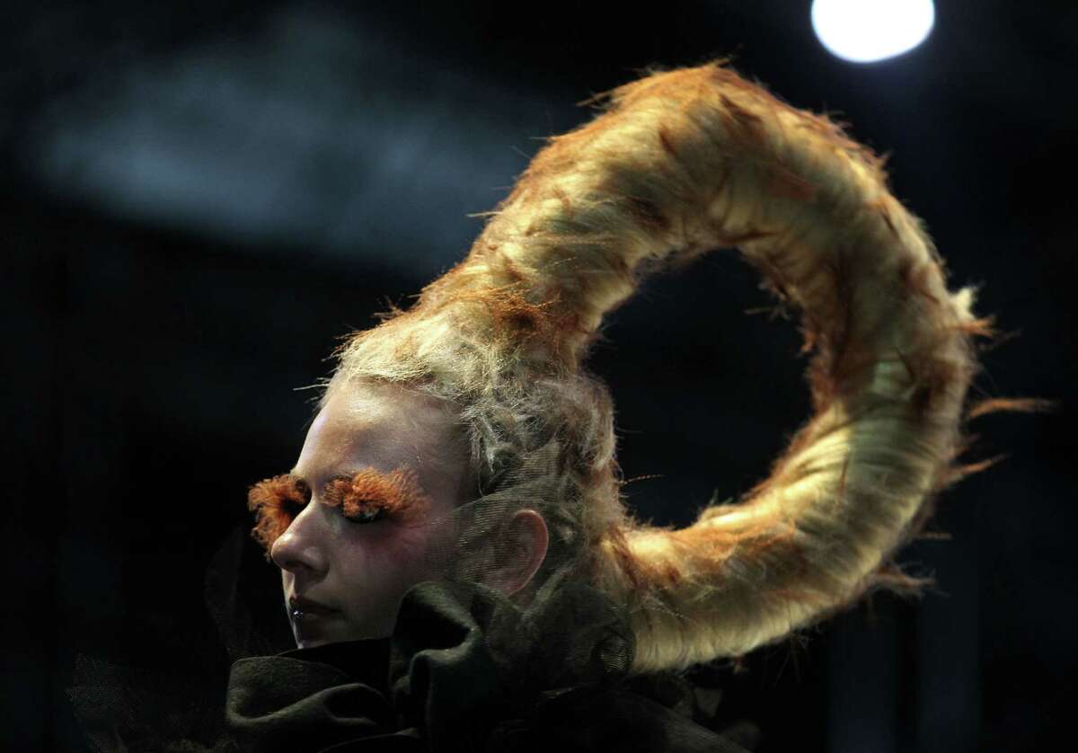 A model showcases hair sculptures created by hairstylists at the Audi Fashion Festival Show of Redken on Thursday May 17, 2012 in Singapore. The annual fashion festival showcases works of top and emerging designers as part of efforts to promote the city-state as a fashion hub.(AP Photo/Wong Maye-E)