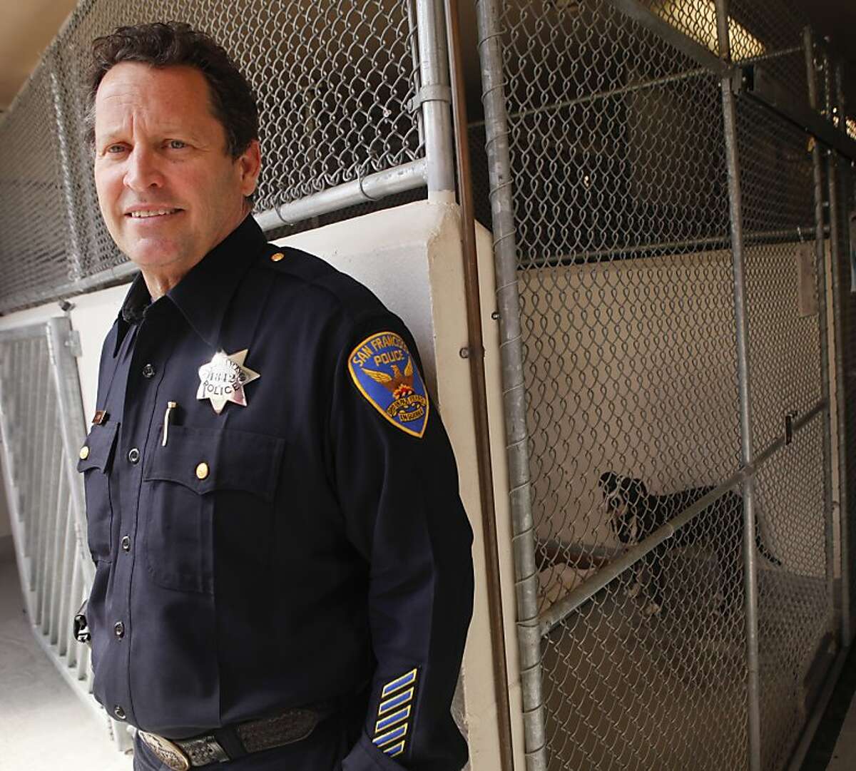 San Francisco Police Officer John Denny, seen in one of the adoptable dog kennels at Animal Care and Control in San Francisco, Calif., on Thursday, April 26, 2012, adjudicates vicious dog hearings and keeps a list of vicious dogs who live in the city.