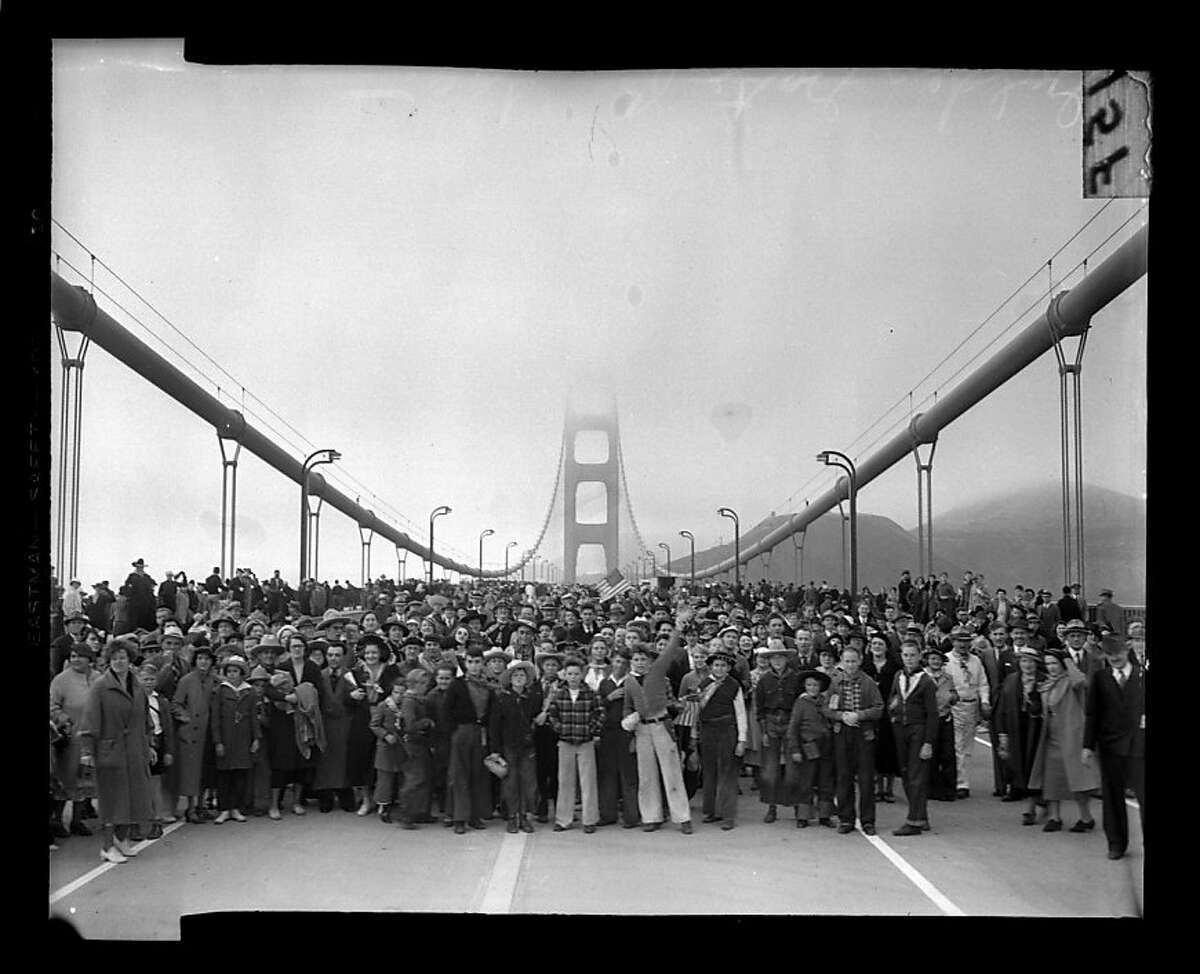 Pedestrians walk across the Golden Gate Bridge on May 27, 1937. San Francisco Chronicle archive photos of the Golden Gate Bridge construction and opening to the public. The city of San Francisco will celebrate the Golden Gate Bridge's 75th anniversary on Sunday, May 27, 2012.