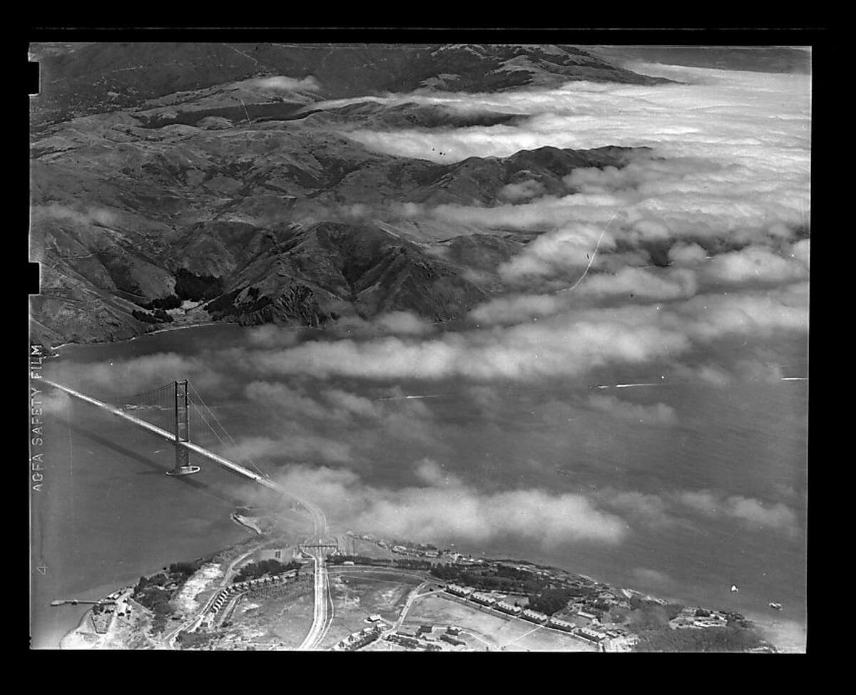 Aerial photo of Golden Gate Bridge with fog in Marin on unknown date. Library envelope says opening day, but there is no foot traffic and minimal vehicle traffic on the bridge. San Francisco Chronicle archive photos of the Golden Gate Bridge construction and opening to the public. The city of San Francisco will celebrate the Golden Gate Bridge's 75th anniversary on Sunday, May 27, 2012.San Francisco Chronicle archive photos of the Golden Gate Bridge construction and opening to the public. The city of San Francisco will celebrate the Golden Gate Bridge's 75th anniversary on Sunday, May 27, 2012.