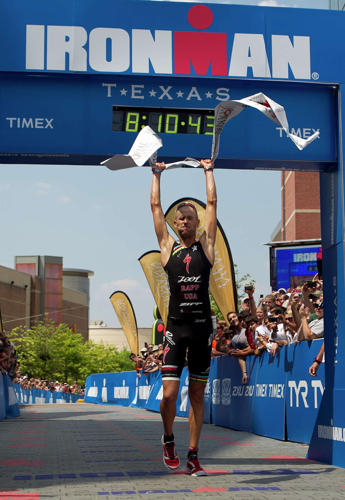 Jordan Rapp celebrates at the finish line after winning the Memorial Hermann Ironman Texas triathlon Saturday, May 19, 2012, in The Woodlands.