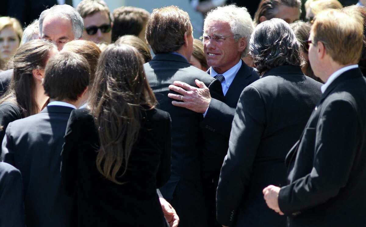 Joseph P. Kennedy II, facing camera, third from right, hugs Robert F. Kennedy Jr., after the funeral of Mary Richardson Kennedy, Robert's estranged wife, at St. Patrick's Church in Bedford, N.Y., Saturday, May 19, 2012. Kennedy was found dead of an apparent suicide this week at her home in Bedford. (AP Photo/Craig Ruttle)