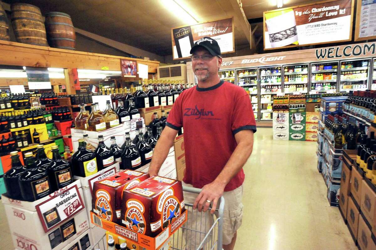 Liquor store customers toast Sunday sales