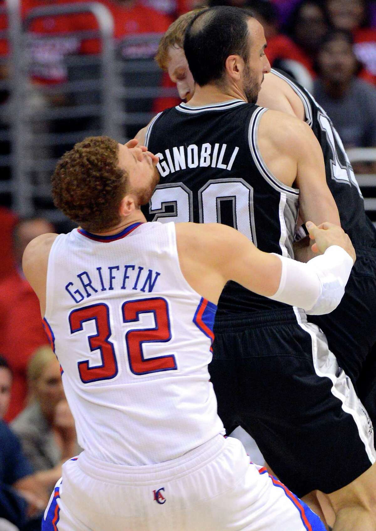 Los Angeles Clippers forward Blake Griffin, left, reacts after running into the back of San Antonio Spurs guard Manu Ginobili of Argentina during the first half in Game 4 of an NBA basketball playoffs Western Conference semifinal, Sunday, May 20, 2012, in Los Angeles. (AP Photo/Mark J. Terrill)