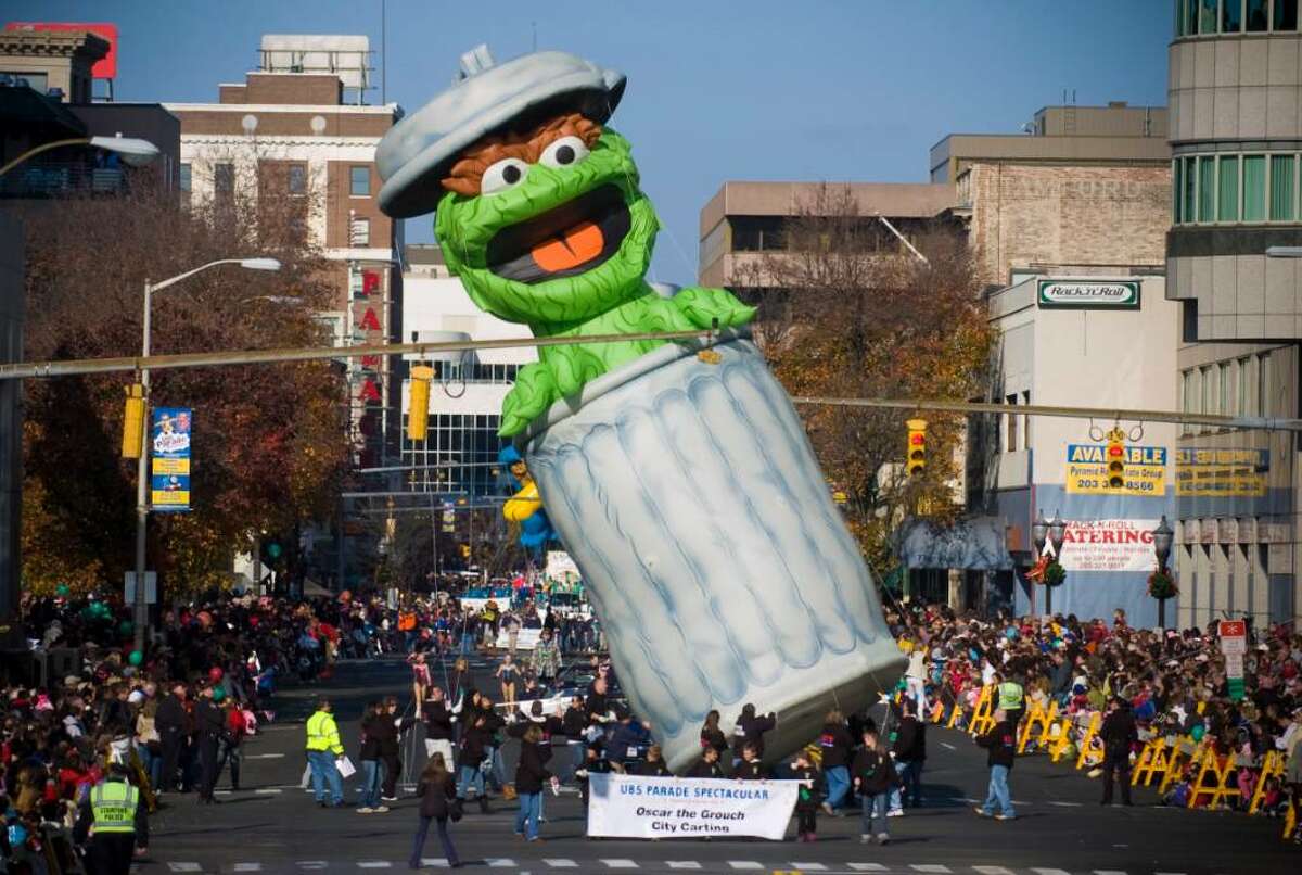 Oscar the Grouch limbos for a traffic light during the UBS Parade Spectacular in Stamford, Conn. on Sunday, Nov. 22, 2009.