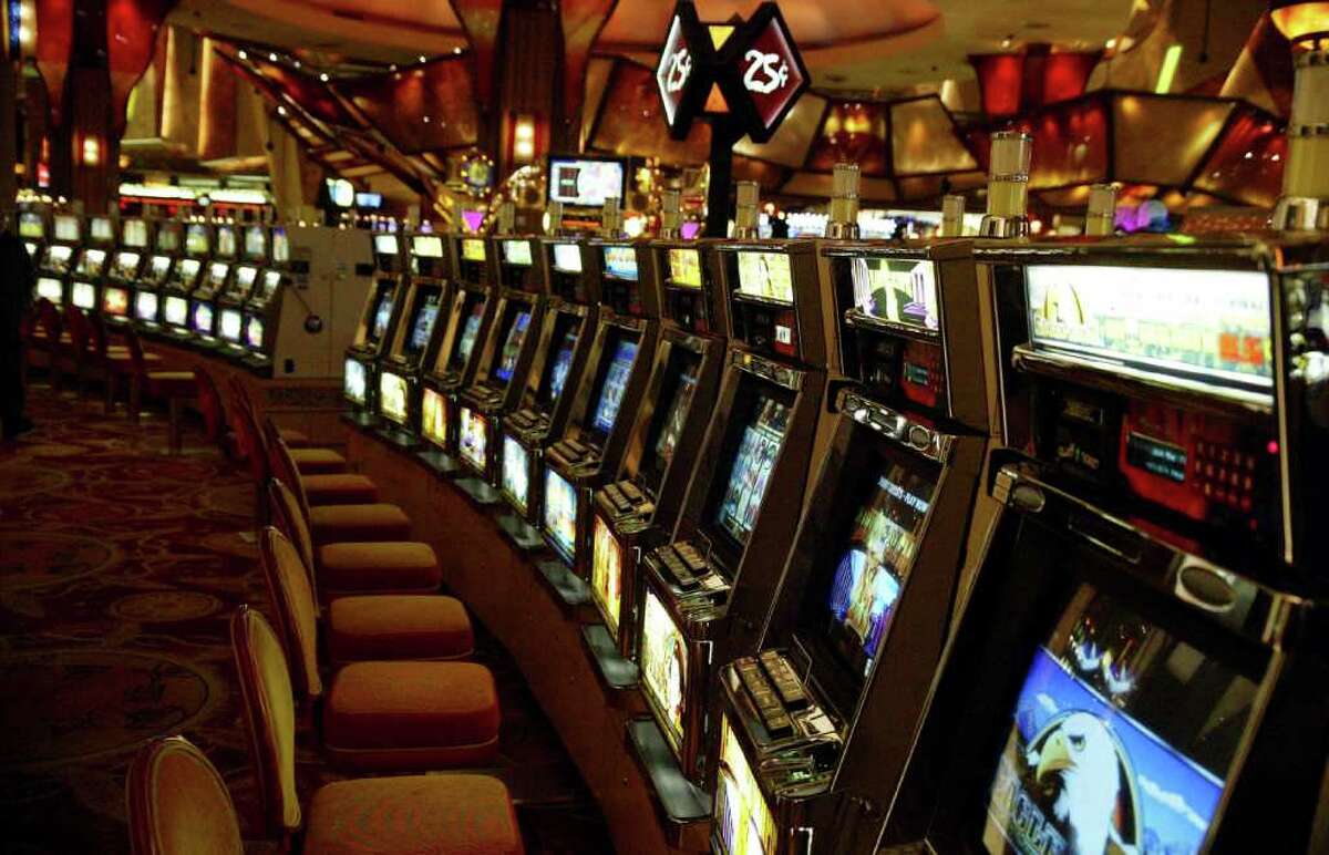 A row of empty quarter slots on the gambling floor at the Mohegan Sun Casino, Thursday, Nov. 19, 2009