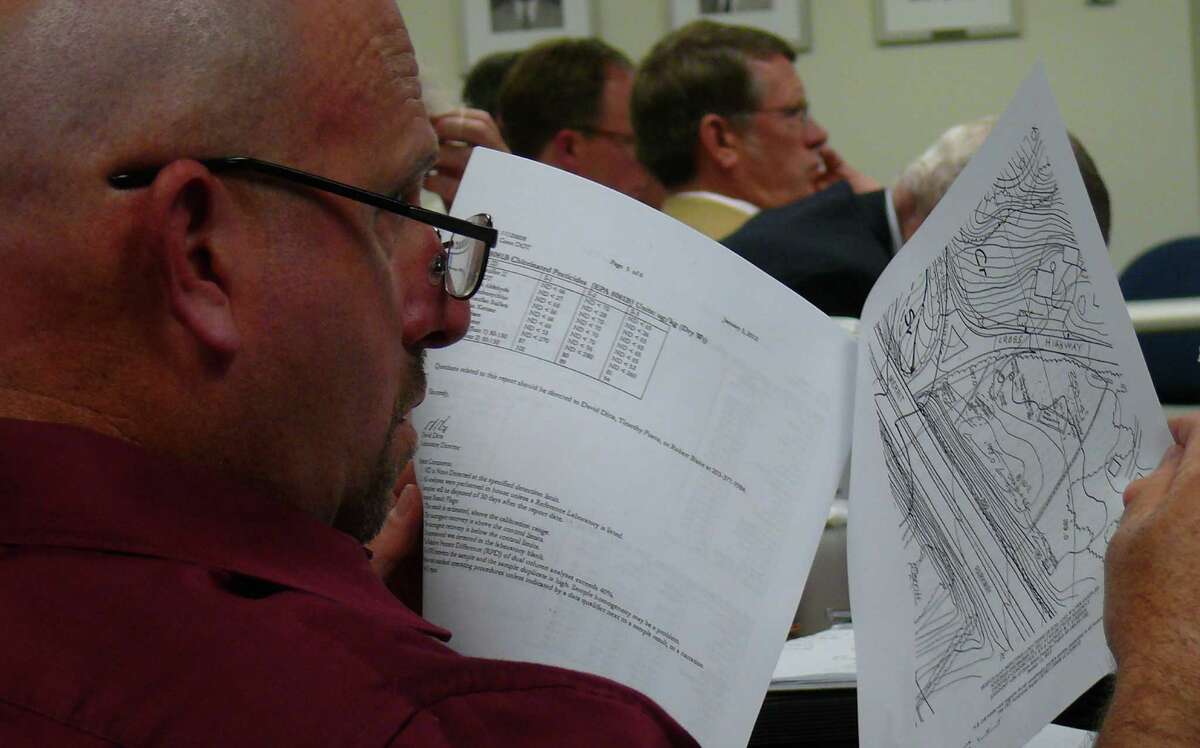 Fairfield Representative Town Meeting Minority Leader Hal Schwartz, D-7, looks over a map of land on Cross Highway that the town will acquire from the state following RTM approval Monday.