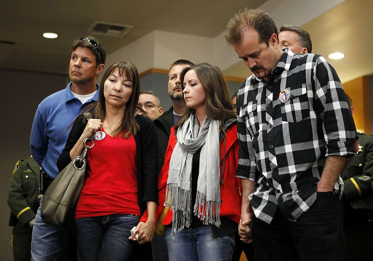 Sierra LaMar's mother, Marlene LaMar (L), sister Danielle (C) and father Steve (R) stand together during a news conference regarding the arrest of Antolin Garcia-Torres at the Santa Clara County Sheriff's Office on Tuesday May 22, 2012 in San Jose, Calif.