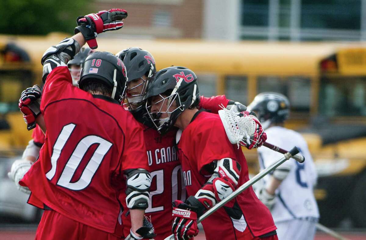 New Canaan celebrates a goal as New Canaan and Wilton face off in the FCIAC boys lacrosse semifinals at Brien McMahon High School in Norwalk, Conn., May 22, 2012. New Canaan won the game, 11-6.
