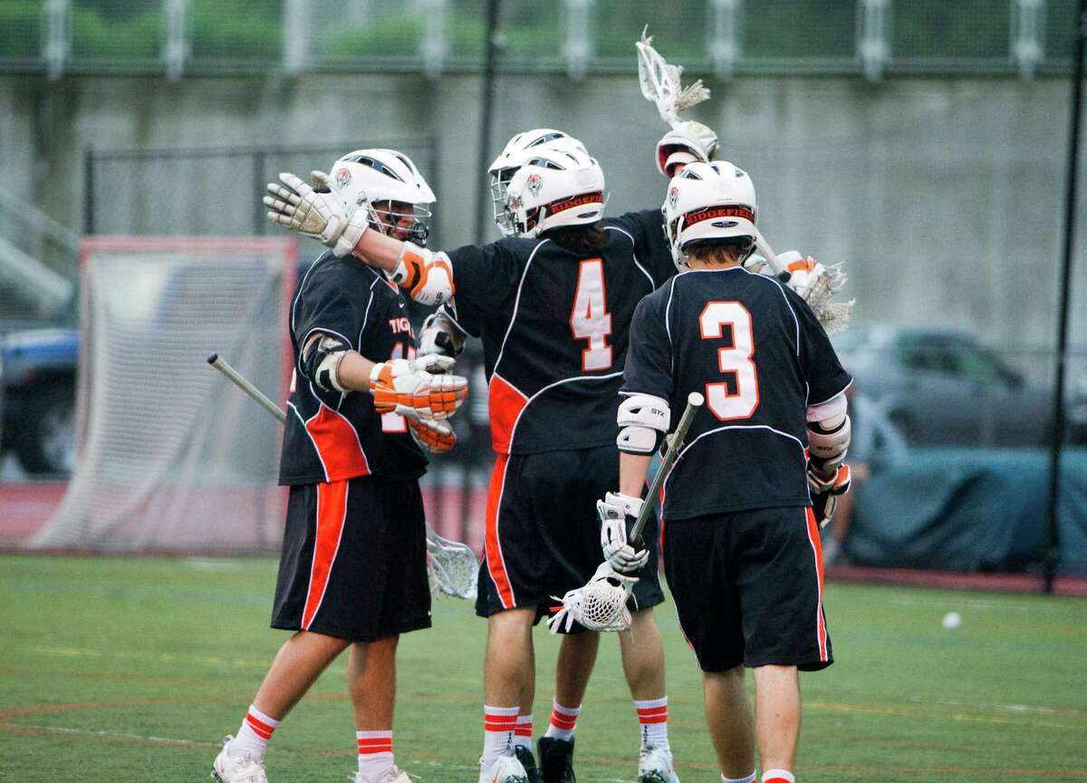Ridgefield celebrates a goal as Darien and Ridgefield face off in the FCIAC boys lacrosse semifinals at Brien McMahon High School in Norwalk, Conn., May 22, 2012.