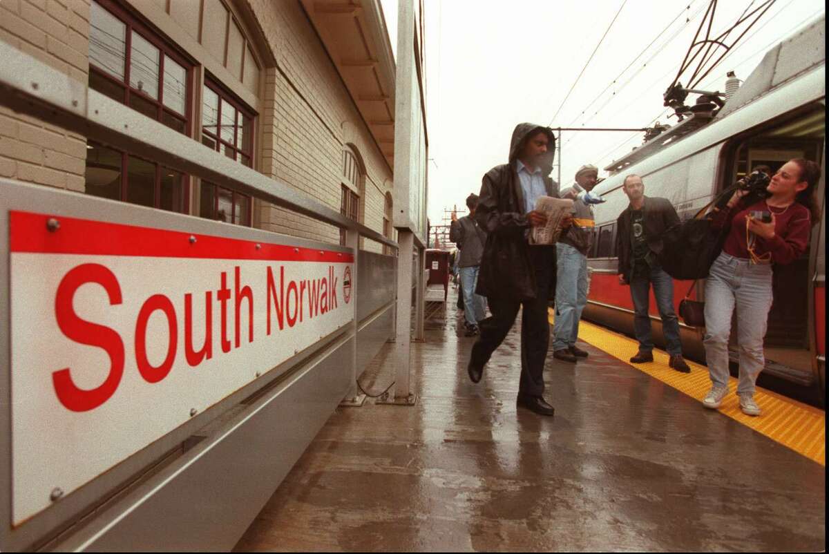 In this file photo Metro-North train riders get off the 3:04 Northbound at South Norwalk Station.