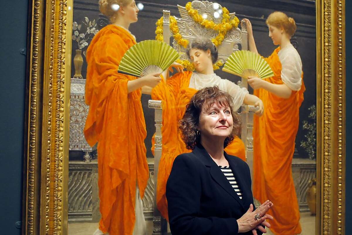 Curator Lynn Orr poses for a picture in front of Albert Moore's "Midsummer", oil on canvas painting of 1887 on display for the "The Cult of Beauty" exhibition at the Legion of Honor in San Francisco, Calif. on May 21, 2012.