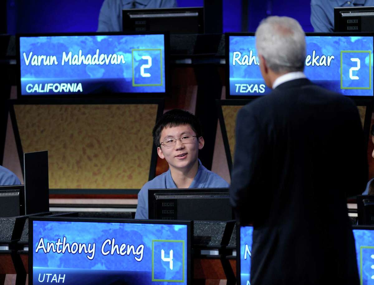 Anthony Cheng, 13, from Midvale Middle School in Midvale, Utah, talks with Alex Trebek during the National Geographic Bee in Washington, Thursday, May 24, 2012. (AP Photo/Susan Walsh)