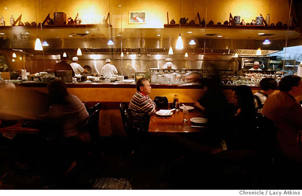 Kirin is a northern Chinese restaurant where the glass enclosed kitchen allows the crowd in the dining room to watch the cooking without the smell of a working kitchen, in Berkely, Feb, 23, 2006.Photo By Lacy Atkins MANDATORY CREDIT FOR PHOTOG AND SF CHRONICLE/ -MAGS OUT