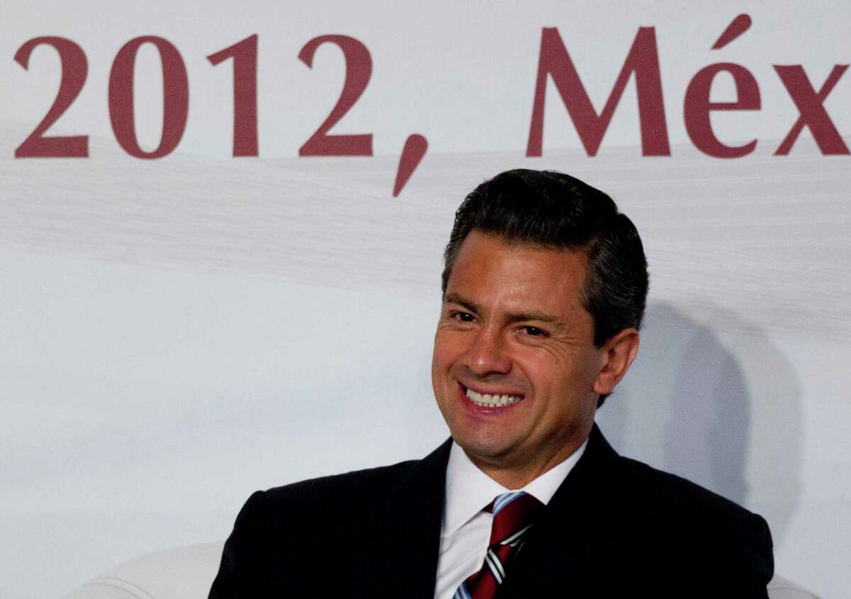 Enrique Pena Nieto, presidential candidate for the Institutional Revolutionary Party (PRI), smiles during a meeting with Mexican universities rectors in Mexico, Monday, May 21, 2012. Pena Nieto, the front-running candidate in the race for Mexico's July 1 presidential election, is pledging to respect transparency and plurality if elected, things his Institutional Revolutionary Party was not known for during 71 years in power.