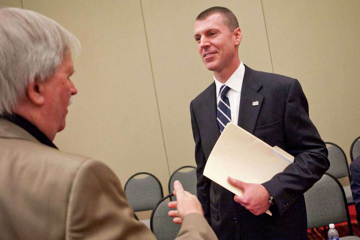 Republican candidate, Chris Meek, right, of Stamford, talks with Woodbury resident Chris Ford. Following Steve Obstinik's win in the Fourth Congressional District nominating convention May 18, 2012, Meek decided to drop out of the race Friday, May 25, 2012.