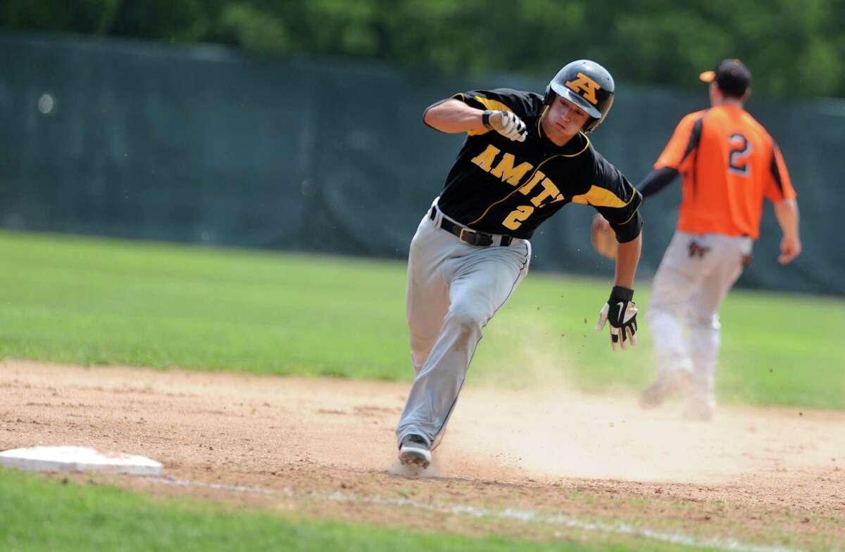 Amity's Vin Siena runs to third base during the Southern Connecticut Conference championship game against Shelton High School Saturday, May 26, 2012 at Yale Field in West Haven, Conn.