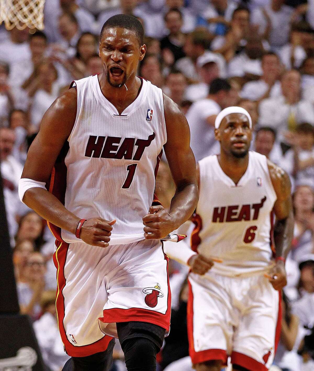 The Heat are acting as though the injured Chris Bosh (left) won't return this season.