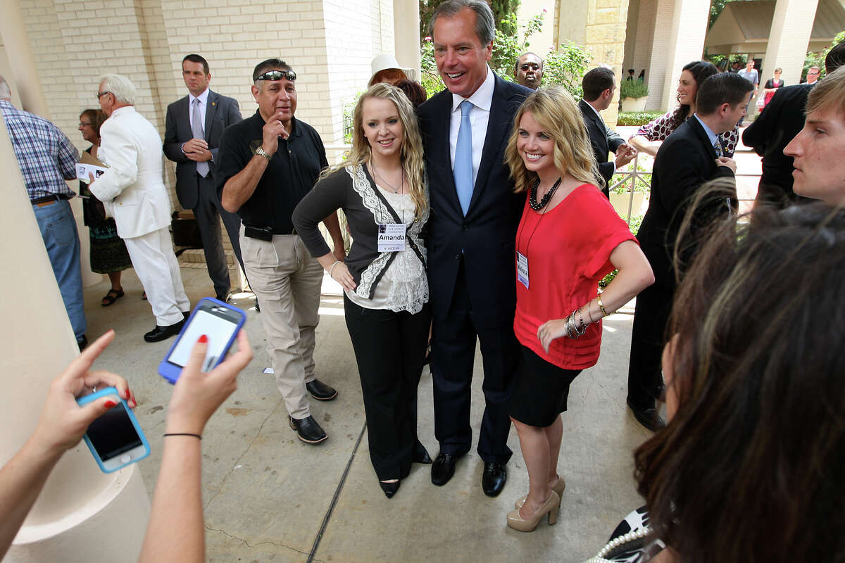 Lt. Gov. David Dewhurst (center), running for the Republican nomination of the U.S. Senate, poses with Cornerstone Church hostesses Amanda Smith (left) and Melissa Trott after Sunday’s service, May 27, 2012.