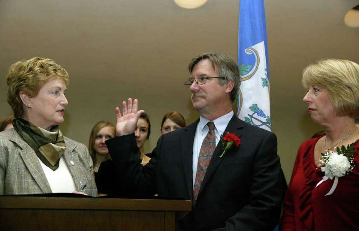 Governor M. Jodi Rell swears in Steve Vavrek, joined by wife Terri, as Monroe First Selectman during a brief ceremony at Monroe Town Hall, Monday, Nov. 23, 2009.