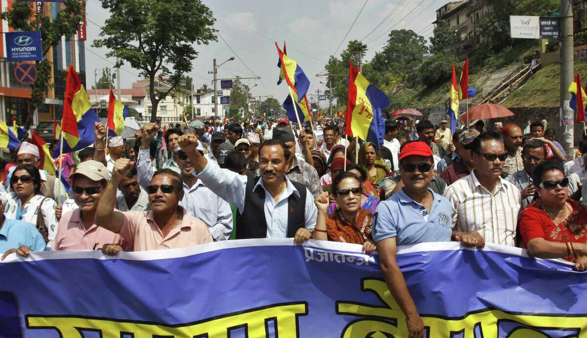 Supporters of pro-monarchy Rastriya Prajatantra Party take out a rally demanding that Nepal be declared a Hindu nation in Katmandu, Nepal, Monday, May 28, 2012. Nepal sank into political turmoil Monday after lawmakers failed to agree on a new constitution, leaving the country with no legal government. (AP Photo/Binod Joshi)