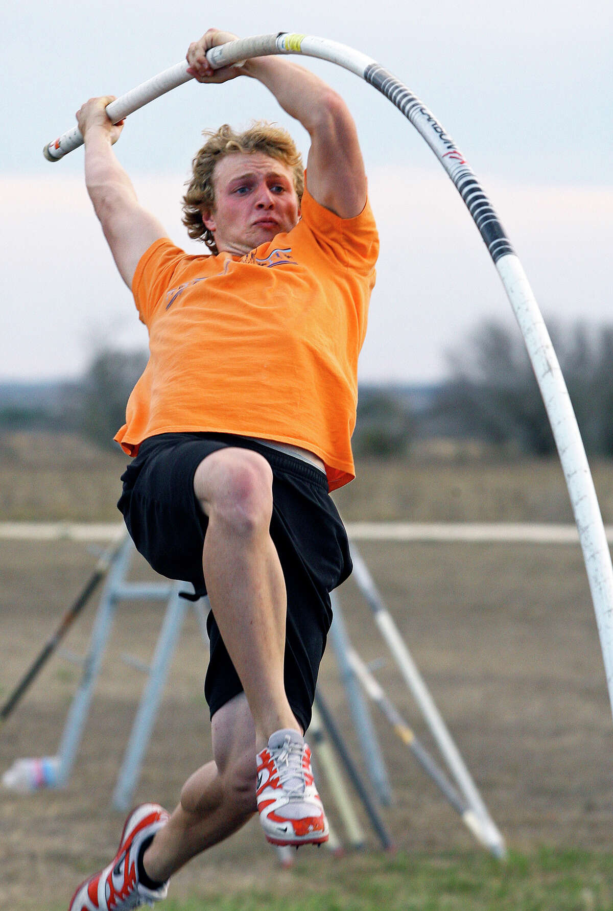 Logan Cunningham drives hard into his jump as he practices pole vaulting technique at Jim Dicksons facility on Feb. 18, 2009.
