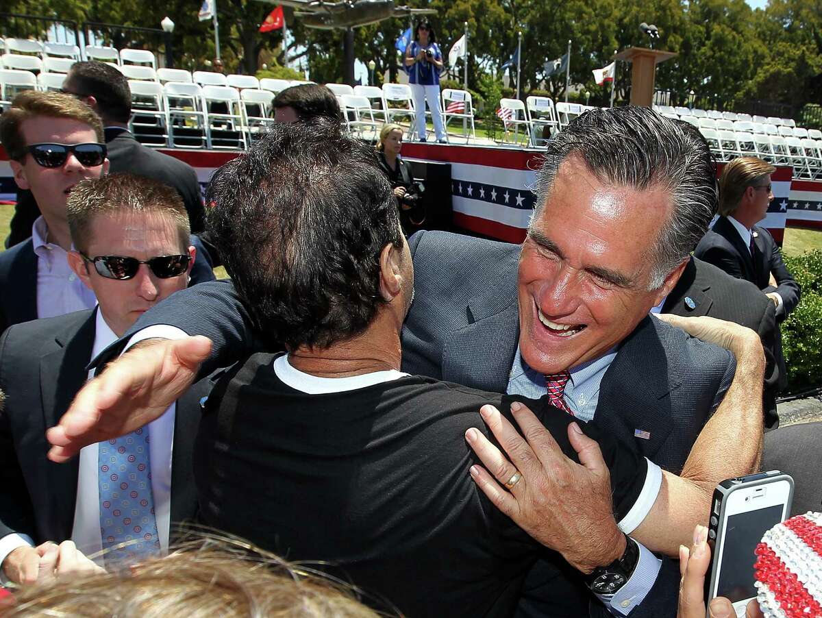 Republican presidential candidate, former Massachusetts Gov. Mitt Romney greets a supporter during a Memorial Day Tribute at Veterans Museum & Memorial Center on May 28, 2012 in San Diego, California. U.S. Sen John McCain (R-AZ) joined Mitt Romney at a Memorial Day tribute before heading to Colorado.