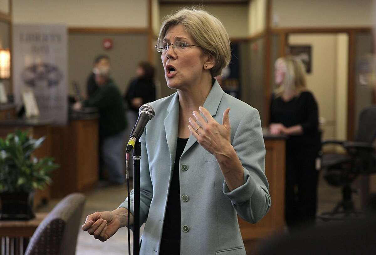 In this May 2, 2012 photo, Democratic candidate for the U.S. Senate Elizabeth Warren faces reporters during a news conference at Liberty Bay Credit Union headquarters, in Braintree, Mass. Warren addressed questions on her claim of Native American heritage. (AP Photo/Steven Senne)