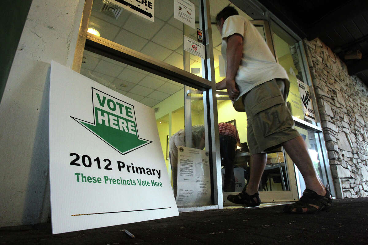 A voter enters the polling site Tuesday, May 29, 2012, at the Olmos Basin Golf Course a few minutes after 7 a.m.