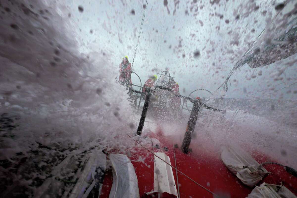 In this photograph provided by the Volvo Ocean Race, Stuart Bannatyne from New Zealand driving with a wall of white water over the deck, onboard CAMPER with Emirates Team New Zealand during leg 7 of the Volvo Ocean Race 2011-12, from Miami, USA to Lisbon, Portugal, on Monday, May. 28, 2012 (Hamish Hooper/CAMPER ETNZ/Volvo Ocean Race photo via AP Images) EDITORIAL USE ONLY