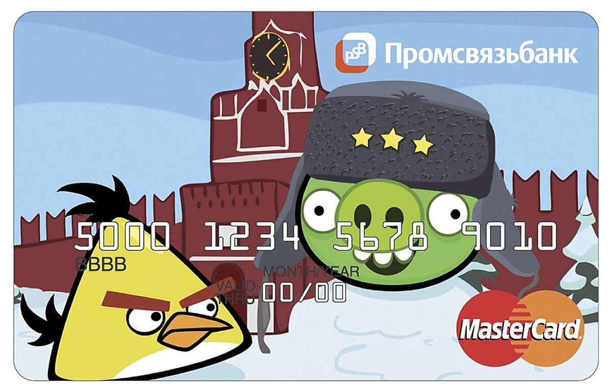 A credit card issued by Russia's Promsvyazbank shows Angry Birds characters, in Moscow, Tuesday, May 29, 2012. Russia's Promsvyazbank has become the first lender to offer their clients credit cards branded with Angry Birds characters. The sign in the top says Promsvyazbank. (AP Photo/Promsvyazbank, HOEP)