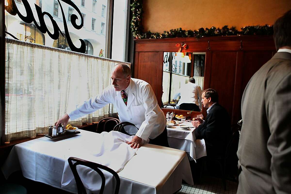 General manager Rick Powers fixing a table at Tadich Grill in San Francisco, Calif., on Thursday, December 15, 2011.