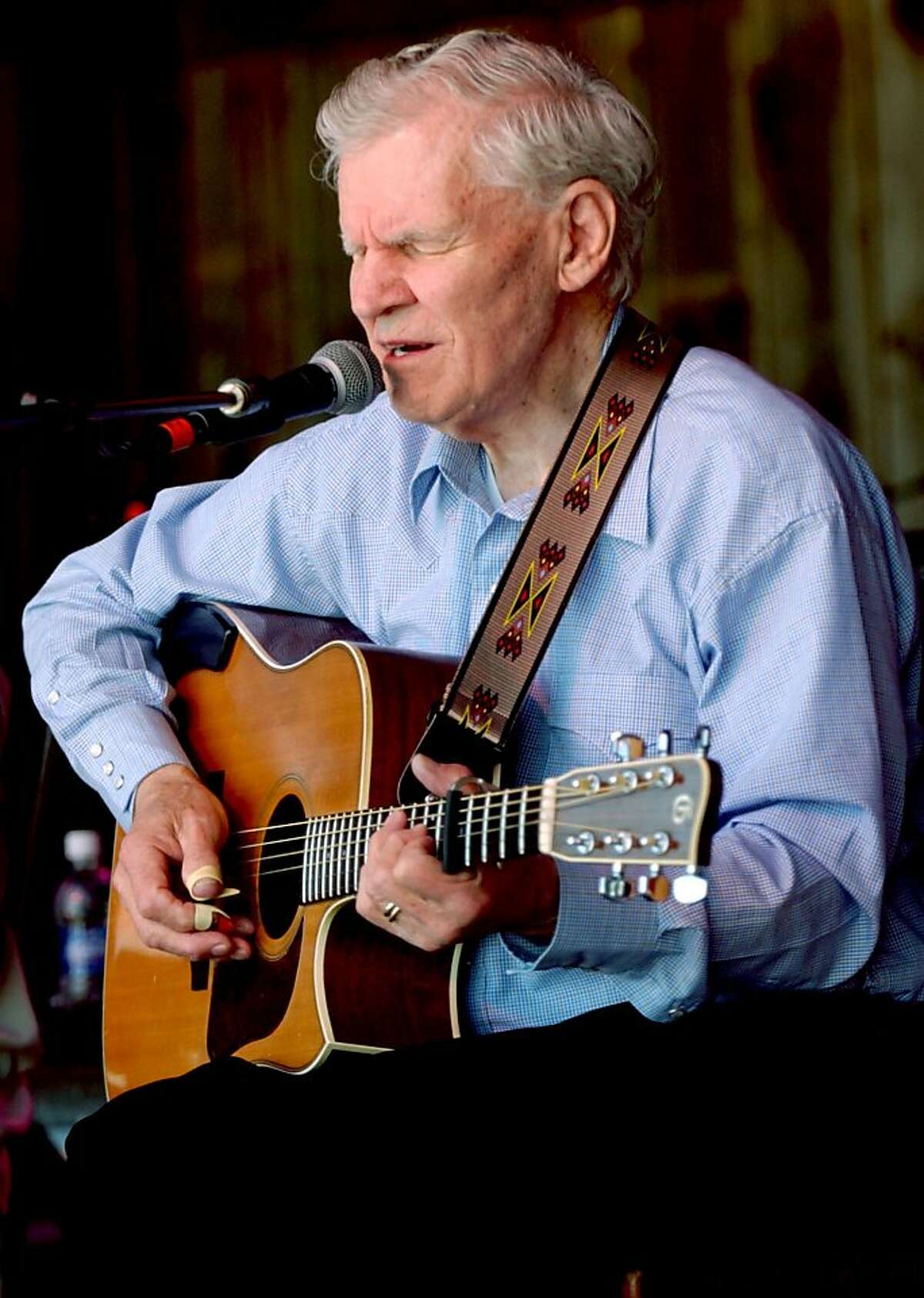 master flatpicker Doc Watson plays during the "My Friend Merle" show during MerleFest in Wilkesboro, N.C. Watson, the Grammy-award winning folk musician whose lightning-fast style of flatpicking influenced guitarists around the world for more than a half-century, died Tuesday, May 29, 2012 at a hospital in Winston-Salem, according to a hospital spokeswoman and his management company. He was 89. (AP Photo/The Winston-Salem Journal, Lauren Carroll)