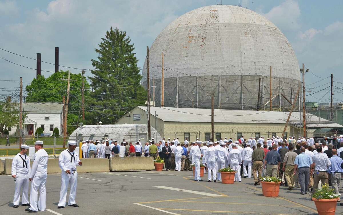 Naval and civilian personel exit the U.S. Naval Nuclear Propulsion Program's official ceremony commemorating the 50,000th nuclear trained sailor to graduate from the Naval Nuclear Propulsion Training Unit at the Knolls Atomic Power Laboratory in West Milton Tuesday May 29, 2012. At right is the D1G prototype for the former guided missile cruiser BAINBRIDGE, now in the process of being dismantled. (John Carl D'Annibale / Times Union)