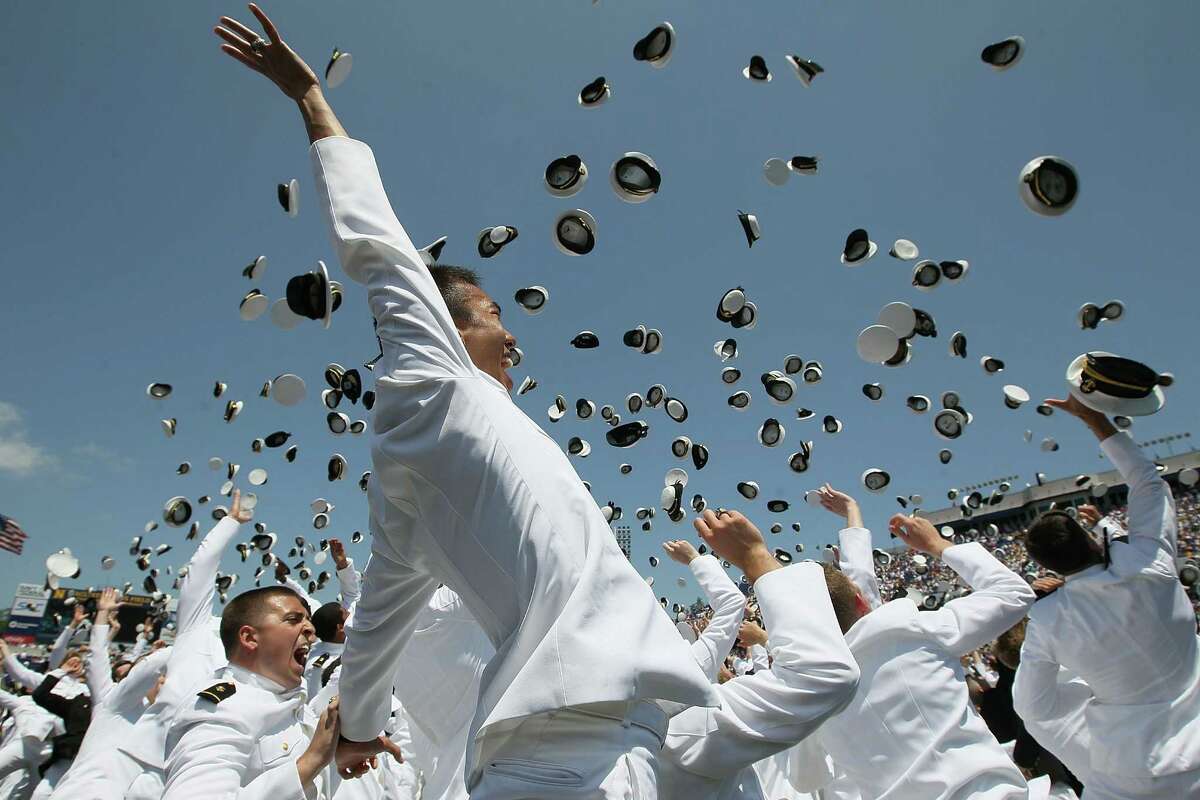 U.S. Naval Academy graduates throw their hats in the air during graduation ceremonies at the U.S. Naval Academy May 29, 2012 in Annapolis, Maryland. U.S. Secretary of Defense Leon E. Panetta was the commencement speaker for the 1099 graduates of the class of 2012. (Photo by Mark Wilson/Getty Images