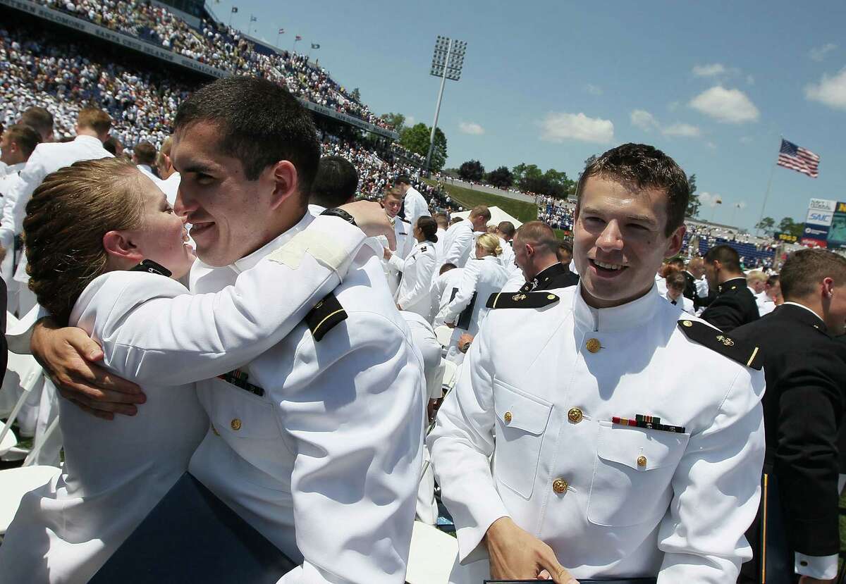 U.S. Naval Academy graduates celebrate after graduation ceremonies at the U.S. Naval Academy May 29, 2012 in Annapolis, Maryland. U.S. Secretary of Defense Leon E. Panetta was the commencement speaker for the 1099 graduates of the class of 2012.