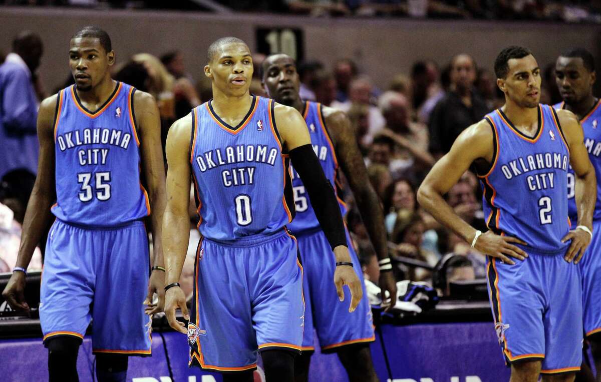 Oklahoma City Thunder's Kevin Durant (35), Russell Westbrook (0), Kendrick Perkins (5), Thabo Sefolosha (2) and Serge Ibaka (9) react against the San Antonio Spurs during the second half of Game 2 in their NBA basketball Western Conference finals playoff series, Tuesday, May 29, 2012, in San Antonio. (AP Photo/Eric Gay)