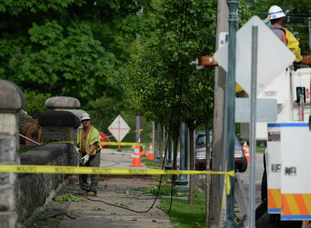 National Grid workers repair damage May 30, 2012, caused by a severe storm yesterday afternoon in front of Empire State College on Union Avenue between Regent Street and Circular Avenue in Saratoga Springs, N.Y. (Skip Dickstein / Times Union)