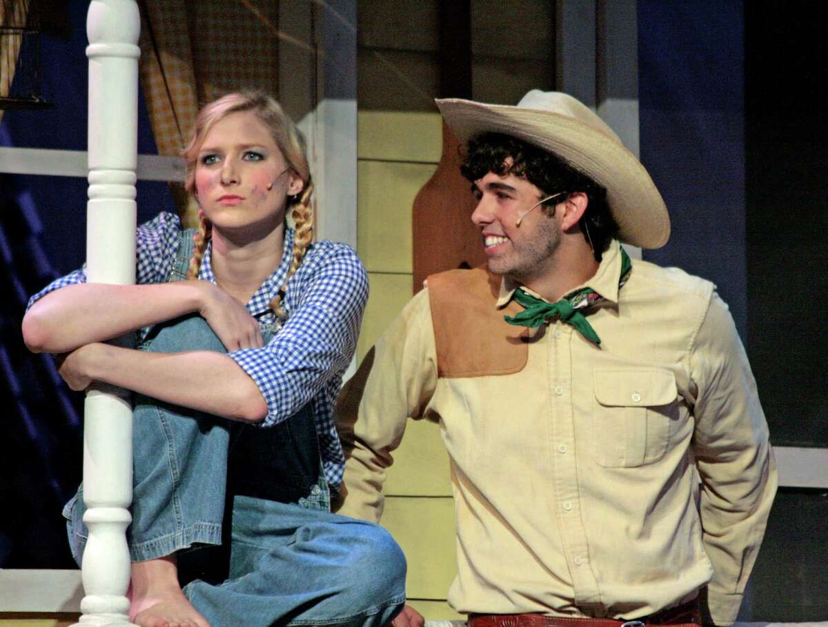 Laurey (Ali Rusch) left flirts with Curly (Andrew Gruseke) in the New Canaan High School production of "Oklahoma!" which will take place June 1 and June 2 in New Canaan, Conn.