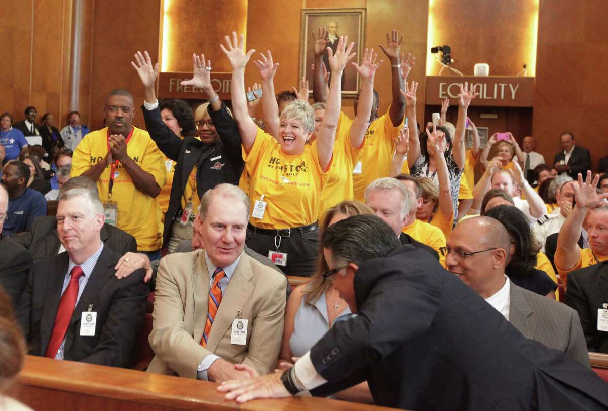 Southwest CEO Gary Kelly is congratulated as Southwest Airlines employees react to the City Council Members' approval of Hobby Airport expanding on Wednesday, May 30, 2012, in Houston. Houston City Council approved a $100 million expansion of Hobby Airport, which allows Southwest Airlines to start international flights for the first time in more than 40 years.