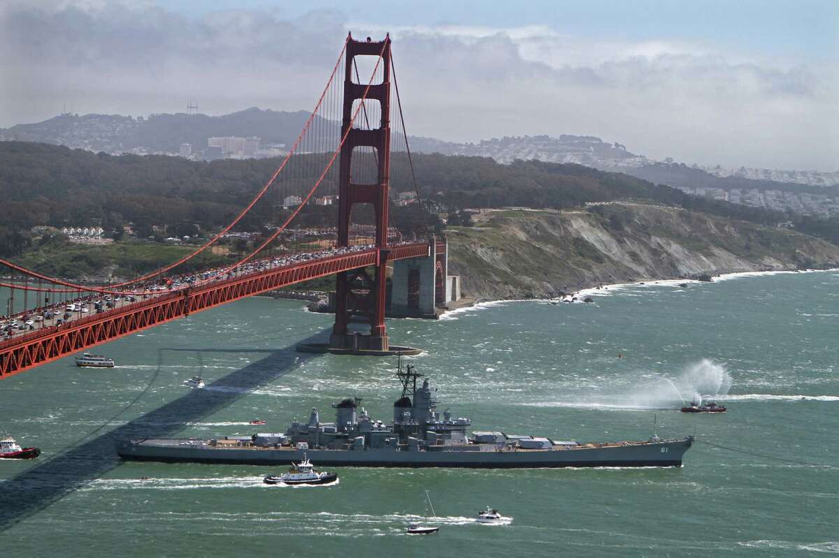 The 45,000-ton Iowa is towed beyond San Francisco, California's Golden Gate Bridge on Saturday, May 26, 2012, as it begins what is expected to be about a four-day trip down the California coast. Coincidentally, the stately passage occurred as the city celebrated the bridge's 75th birthday.